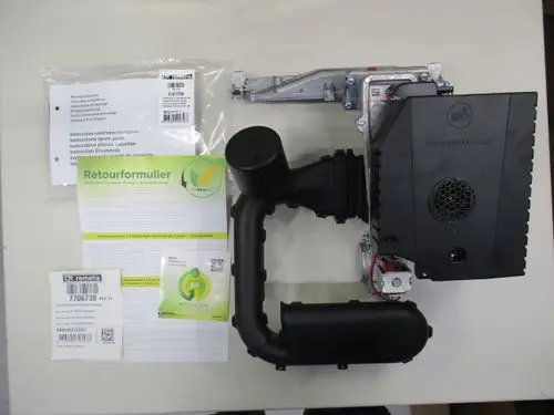 Gasgebläse von Remeha mit montierter PCB-Platine und Ventil, Bedienanleitungen und Rücksendeformular auf hellem Untergrund.